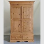 A pine double wardrobe,