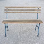 A green painted metal and slatted hardwood garden bench,