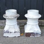 A pair of white painted chimney pots,