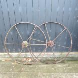 A pair of cart wheels,