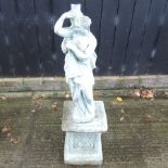 A reconstituted stone garden figure of a lady, on a pedestal base,