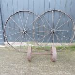 A pair of cart wheels,