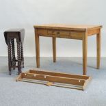 A pine kitchen table, with a single drawer, on square tapered legs, 106cm,