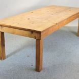 A large pine rectangular dining table,