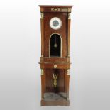 A 19th century Empire style mahogany and gilt metal mounted longcase clock,