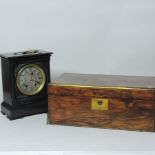 A Victorian black slate mantel clock, 27cm high, together with a Victorian walnut writing slope,