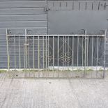 A pair of black painted wrought iron gates,