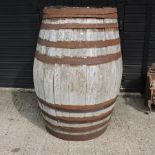 Withdrawn - A large coopered oak barrel,