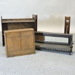 An Edwardian oak wall shelf, together with three others,