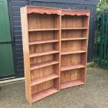 A pair of standing open bookcases,