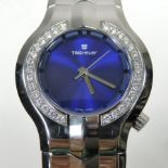 A Tag Heuer diamond set steel cased ladies wristwatch, having a signed blue dial,
