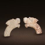 A PAIR OF CHINESE JADE DRAGON HEADS