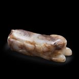 A CHINESE INSCRIBED WHITE AND RUSSET JADE TIGER TALLY