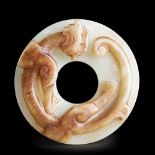 A CHINESE WHITE AND RUSSET JADE CHI-DRAGON DISC, BI