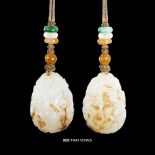 A CHINESE WHITE AND RUSSET JADE DRAGON-MONKEY PENDANT