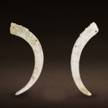 A PAIR OF CHINESE WHITE JADE MAN-DRAGON POINTED PENDANTS, XI