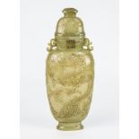 A fine Chinese relief carved spinach jade lidded vase, of tapering flattened ovoid form, the main