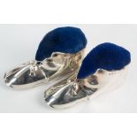 A matched pair of novelty boot form silver pin cushions, Cohen & Charles and Levi & Salaman,