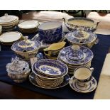 A collection of transfer printed dinner ware, late 19th / early 20th century, to include cups,