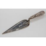 A Victorian silver trowel form bookmark, Birmingham 1887, chased handle, 3½in. (8.8cm.) long, 0.16