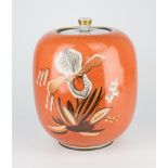 A Royal Copenhagen orchid decorated jar and cover, c.1936, crackle glaze on orange ground, gilt