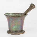 A bronze pestle and mortar, campana form mortar with brass pestle, on flared circular base, 4 x 5in.