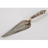 An Edwardian silver trowel form bookmark, Adie & Lovekin, Birmingham 1909, graduated knopped