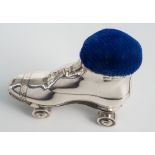 An Edwardian silver novelty roller skate pin cushion, Crisford & Norris, Birmingham 1909, with