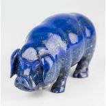 A carved Lapis Lazuli male pig, 4¼in. (10.8cm.) long, 2½in. (6.3cm.) high.