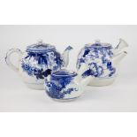 Three blue and white Oriental teapots, two of globular form, one with short curved spout and