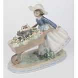 A Lladro figure, 'Barrow of Fun', pattern number 5460, issued in 1988, sculpted by Regino