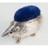 An Edwardian silver novelty hedgehog pin cushion, Adie & Lovekin Ltd., Birmingham 1908, with inset