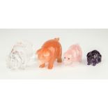 Four carved stone miniature pigs, carved from rock crystal, rose quartz, cherry quartz and amethyst,