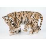 A Royal Copenhagen porcelain tiger and cubs, no.4687, 5¾h x 10w.in. (14.5 x 25.4cm.)