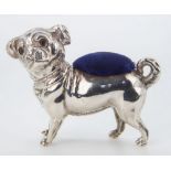 An Edwardian novelty silver pug dog pin cushion, Crisford & Norris Ltd., Birmingham 1905, with inset