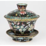 A Chinese cloisonné bowl, cover and stand, polychrome floral decoration on black ground, turquoise