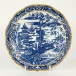 A blue and white transfer print pattern shallow bowl, late 19th century, scalloped gilt rim over