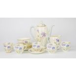 A Royal Doulton tea service, six person setting, (five cups only) decorated with flowering