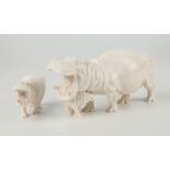 Two carved ivory hippopotamus figures, both signed 'Solly More', the larger figure carved with mouth