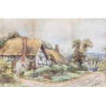 Ernest T. Potter (early 20th Century), Thatched cottage on a country lanewatercolour11¼ x 17½in. (