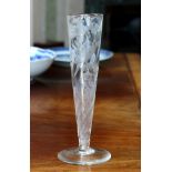 An engraved glass posy vase, c.1900, the elongated trumpet bowl with wrythen moulding, engraved