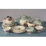 A Susie Cooper 'Kestrel' tea service, Crown Works, Burslem, painted orchid decoration, inc. teapot,