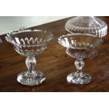 Two Georgian cut glass footed sweetmeat dishes, both cup bowls with everted shaped cut rims and