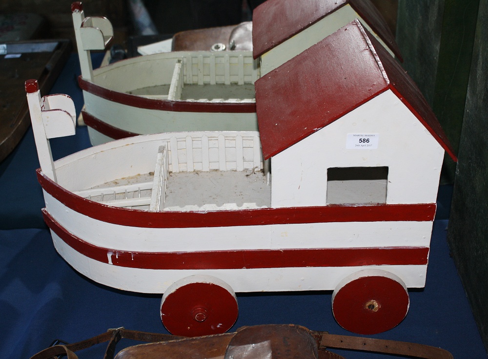 A painted wooden pull along toy boat, 1950s,