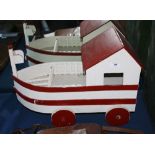 A painted wooden pull along toy boat, 1950s,