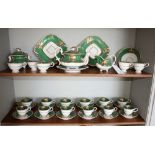 A Derby style part tea and coffee service, 19th century, green and gilt decoration with hand