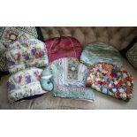 A collection of tea cosies, including Eastern, elephant, quilted and silk examples,