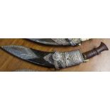 A presentation Kukri knife, early 20th century, typical curved blade with ring turned flared wooden