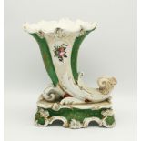 A 19th century English porcelain cornucopia vase, in the manner of Jacob Petit, flared shaped rim,