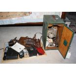 A quantity of cameras and photographic accessories, to include a 1930s No. 4 folding pocket Kodak;